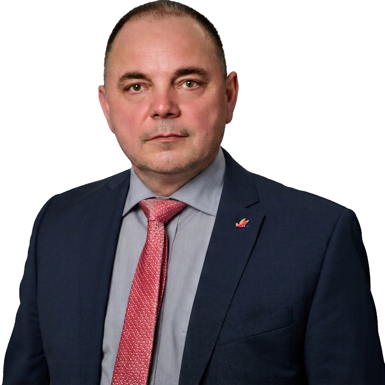 Torsten Behnke im Anzug vor dunklem Hintergrund